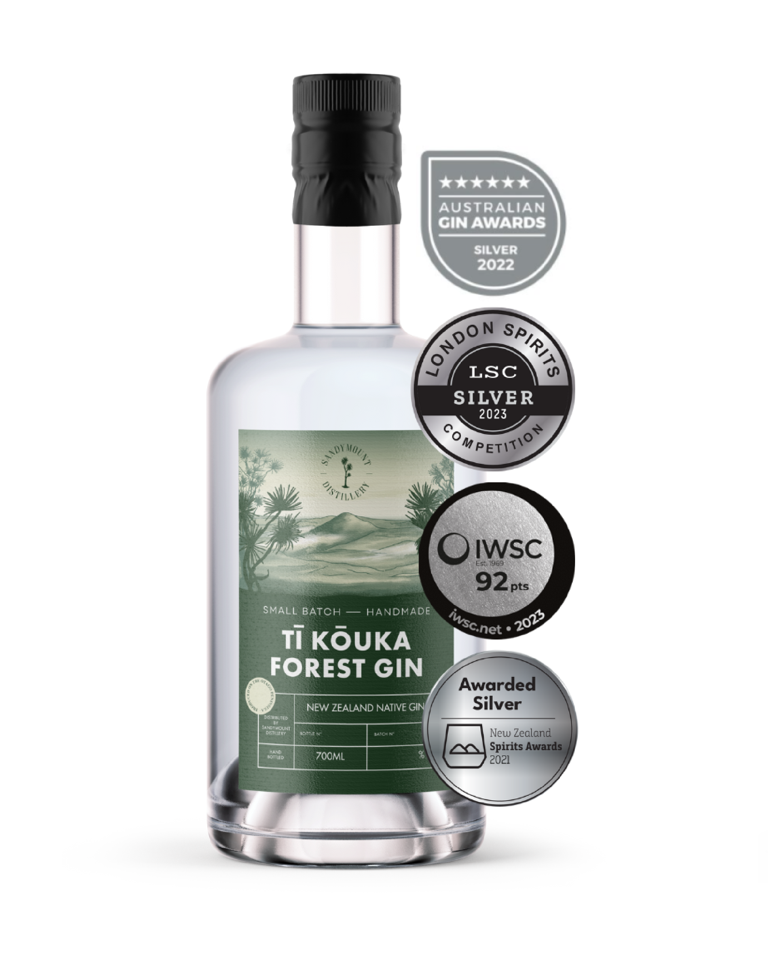A clear glass bottle with clear liquid in it and a label on the front. The green label has illustrations of bush and a hill landscape, titled Tī Kōuka Forest Gin