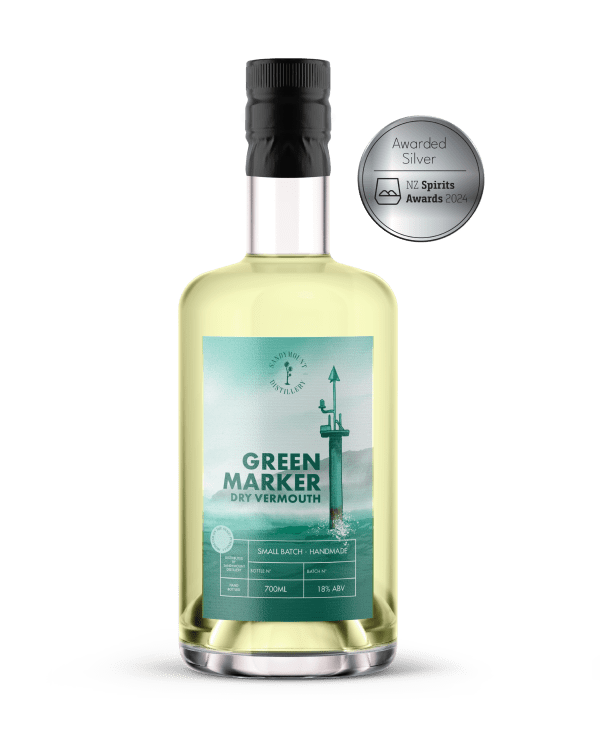 A clear glass bottle with greenish/ yellow liquid (dry vermouth). On the bottle is a green label with a ship marker from the harbour and is titled Green Marker.