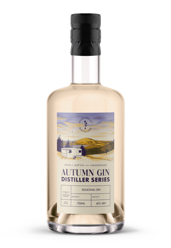 A clear glass bottle filled with a light yellow gin. A label on the front saying "Autumn Gin, Distiller Series" with imagery of a caravan overlooking an inlet and mountain in the distance with pastel yellow and purple tones